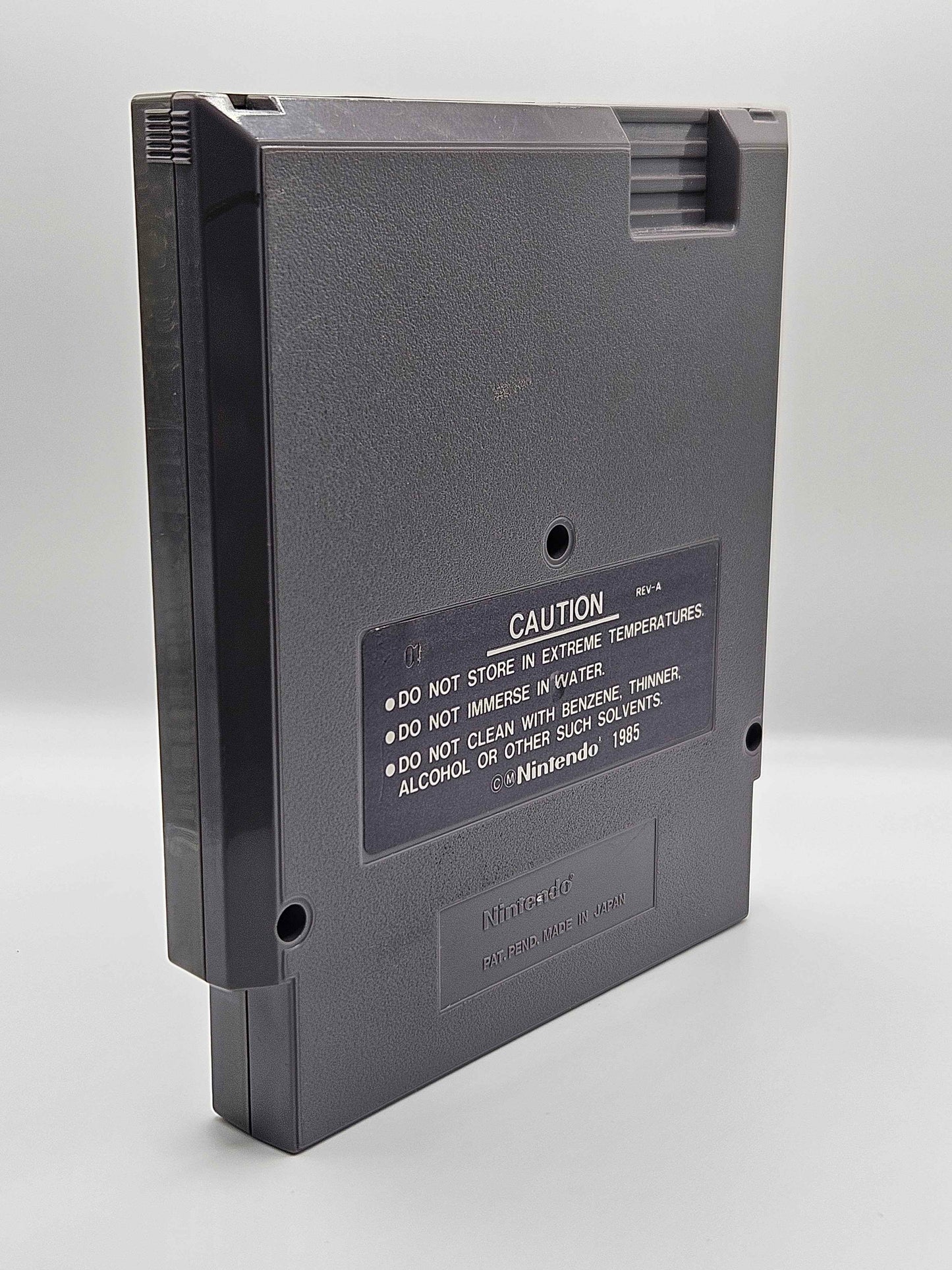 A Nintendo Entertainment System (NES) cartridge for the game 'Stealth' (back).